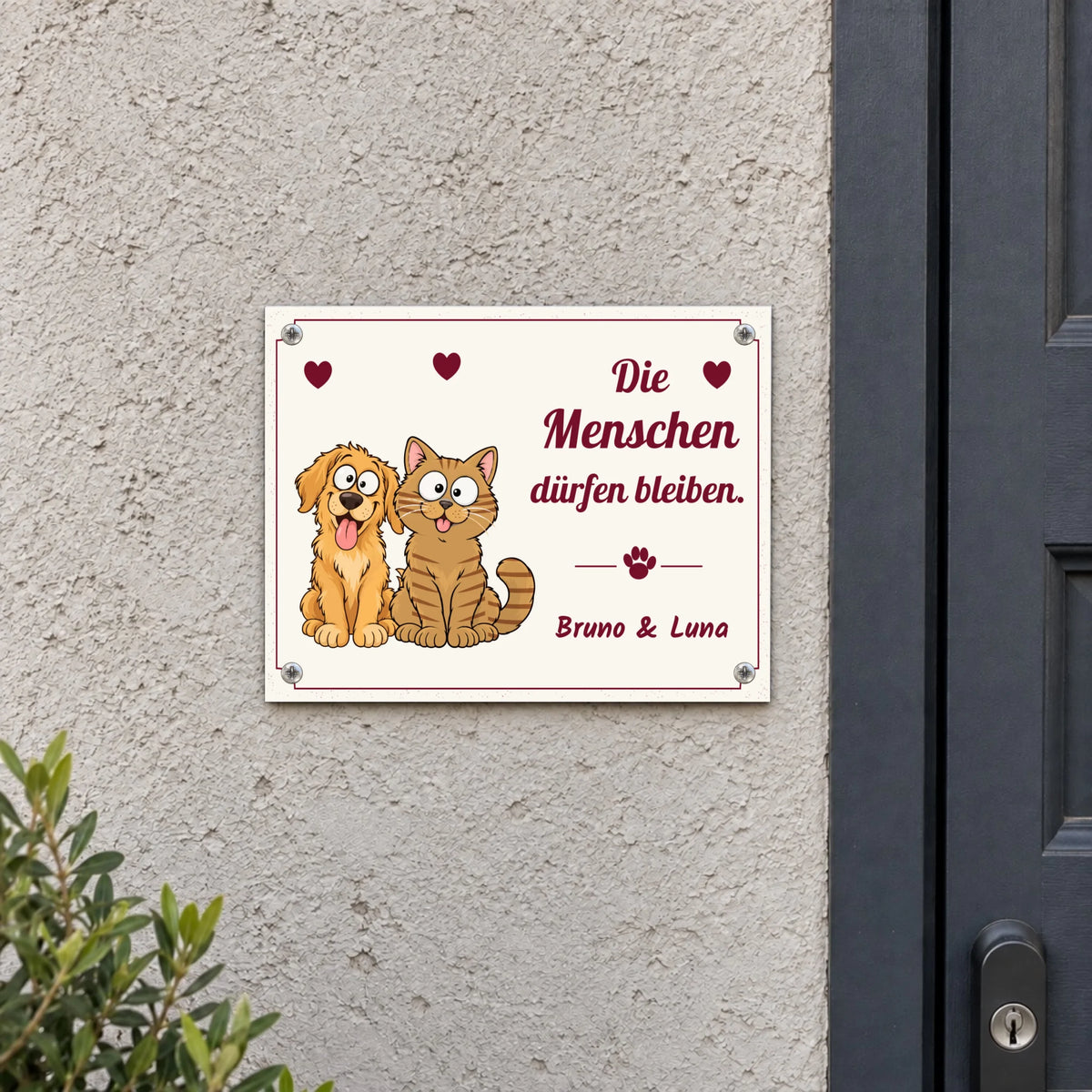 Metallschild „Die Menschen dürfen bleiben“ an der Hauswand, 40 x 30 cm