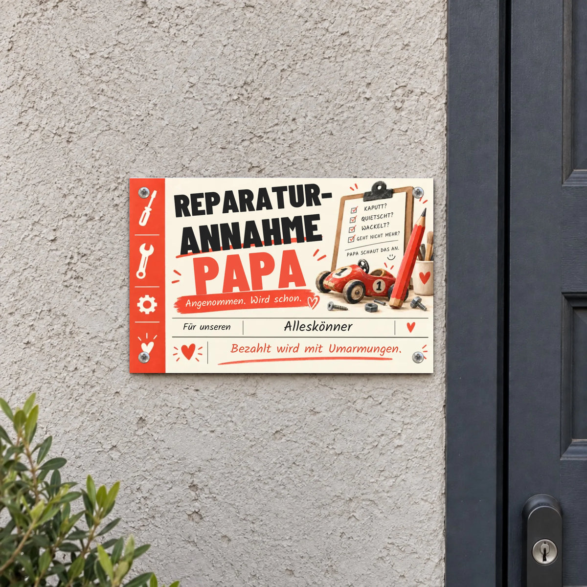 Personalisiertes Metallschild „Papas Werkstatt“ mit Reparaturannahme-Motiv und Werkzeug-Illustrationen an einer Wand